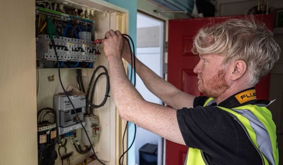 A connolly electrician inspecting a domestic consumer unit people onsite