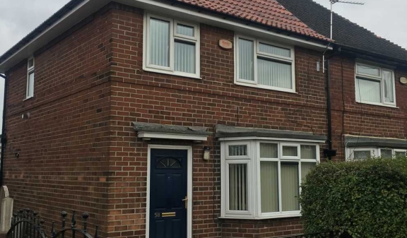 A refurbished brick semi-detached home viewed from the street