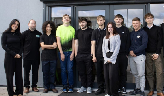 Apprentices outside front door