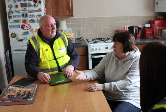 Connolly staff meeting residents around a kitchen table residents