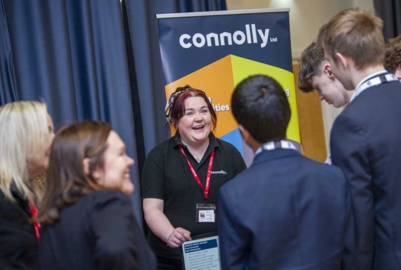 Connolly staff networking with students at a careers event social value charity